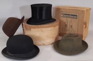 Four vintage hats including a black silk top hat by Scott & Co, internal size 20x16.5cm, a bowler