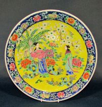 A group of Chinese export porcelain to include a large charger decorated with figures in landscape