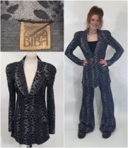 A late 1960s Biba two piece trouser suit in black/ grey leopard style jersey fabric; jacket has 3