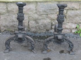 A large pair of country house cast iron fire dogs, 30cm high, 40cm deep.