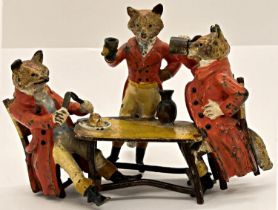 Good cold painted bronze group - Mr Fox's Breakfast, showing three foxes in hunting pink around a