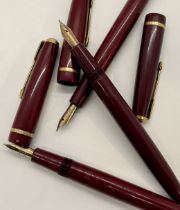 Five Parker fountain pens all in maroon colourway, four slimfolds and one victory model