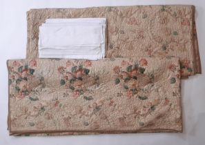 A pair of vintage quilted bedspreads in a printed floral cotton chintz, quilted in chain stitch
