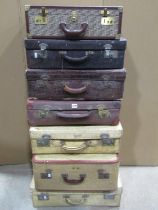 A group of seven various leather, velum suitcases, some with original travel labels (7)