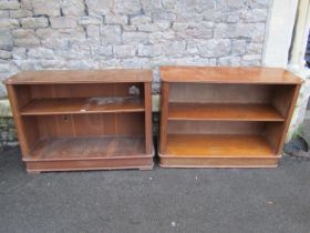 A pair of small oak freestanding bookcases, loosely in the Art Deco style, each measuring 73cm high,