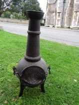 A cast iron chimenea (with cover)