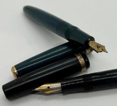 Five vintage Parker fountain pens, duofold, four in black one in dark blue