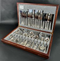 A Canteen of Sheffield cutlery with beaded handles, complete for eight settings.