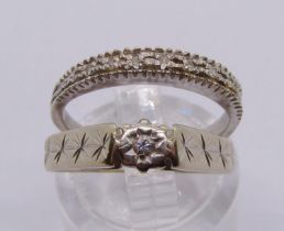 Two white gold diamond set rings; an 18ct half hoop ring, size K, 2.4g and a 9ct solitaire ring,