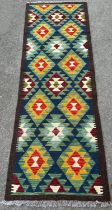 A Maimana Kilim runner, with diamond and hooked medallions, 200cm x 63cm