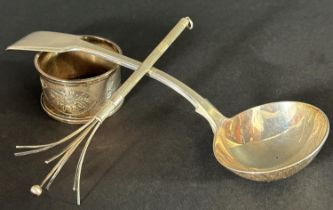A Victorian silver sauce spoon, London 1860, makers The Portland Company, a silver napkin ring and a