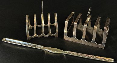 Two silver toast racks both English hallmarked and a silver plated marrow scoop, 3.8 oz approx (3)