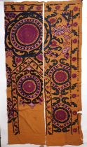 2 sections from an Uzbek type Suzani panel each with hand embroidered floral motifs in bold