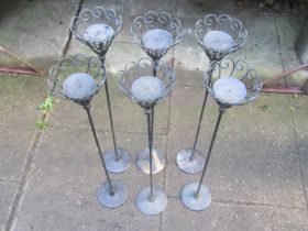 Two small decorative light pressed steel and iron work garden ornaments in the form of a peacock and