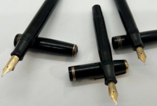 Three vintage Parker fountain pens comprising two Vacumatic and one Premiere, all in black
