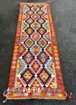 Chobi kilim runner with a multi coloured repeating diamond pattern 253 x 82 cm approx