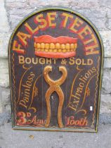 A decorative painted advertising board in the Edwardian style, ‘False Teeth Bought & Sold, painless,