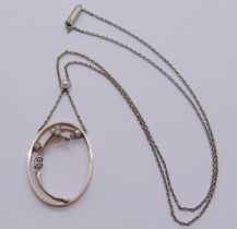 Early 20th century platinum and gold spray pendant necklace, set with a pearl and five diamonds,
