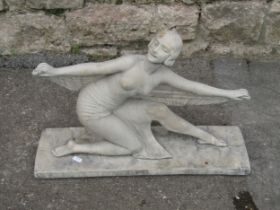 In the style of Demétre Chiparus, a composition stone figure of a stylised Art Deco lady dancer in