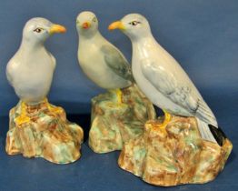 Three Radford pottery models of standing seagulls, each 22 cm high, together with a novelty three