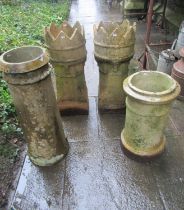 A pair of weathered buff coloured crown top chimney pots, 77cm high together with two further buff