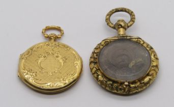 Two antique yellow metal pendants; a locket stamped '77' to interior and a Victorian example