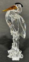 Two Swarovski crystal animals a giraffe and a Heron.