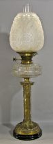 A good Victorian oil lamp, the brass Corinthian column base supporting a clear glass reservoir