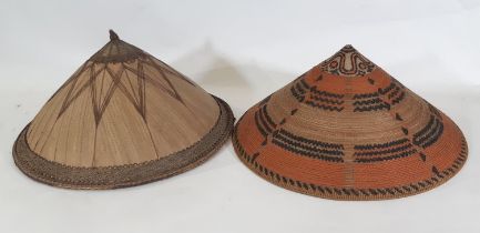 Two early to mid 20th century traditional Asian conical hats; first a stitched cane fibre hat from