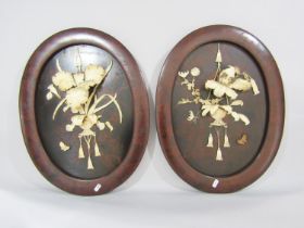A pair of Japanese oval lacquered export bone-work panels 54cm x 42cm