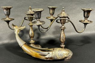 A miscellaneous collection of silver plated table wear, including a carved horn fish with silver