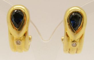 Pair of 18ct pear-cut sapphire and diamond earrings, with hinged posts and clip fastenings, 7.7g