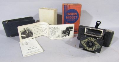 An Ensign Midget Camera, complete with its leather cover, instruction pamphlet, service and