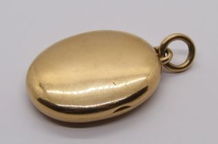 Antique 15ct locket containing a picture and lock of hair, 16.7g