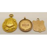 Three antique 9ct medal fobs; a 1919 boating example, a 1912 'Cainscross & Ebley Cooperative Society