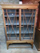 19th century stripped pine display cabinet enclosed by a pair of astragal glazed panelled doors with