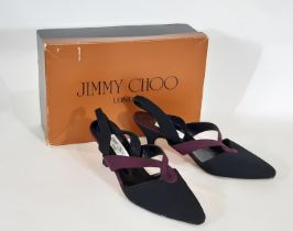 A pair of Jimmy Choo ladies shoes size 6.5 with black textile upper, purple detailing, sling back