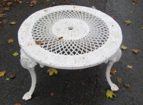 A low painted cast iron circular garden table, the decorative pierced lattice top with repeating