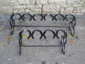 Two novelty boot racks constructed from horseshoes, the largest 88cm long x 28cm high