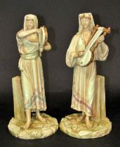 Pair of James Hadley modelled Royal Worcester figures of Egyptian musicians with gilded detail,