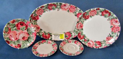 A quantity of German porcelain tea and dinner wares, with gilt borders and initialled ‘P’ together