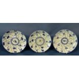 Three late 18th century Chinese export blue and white porcelain plates, each decorated with