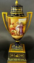 A Vienna Dresden porcelain lidded vase on plinth base, with blue and gilt banded panels, the