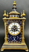 A late 19th century brass and champleve enamel cased mantle clock , with a white enamelled chapter