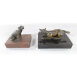 A miniature cast bronze of a crouching fox, 13cm long set on a polished slate plinth, together