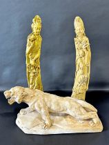 A tall pair of Chinese carved simulated ivory tusks, one in the form of Guanyin, the other of a sage