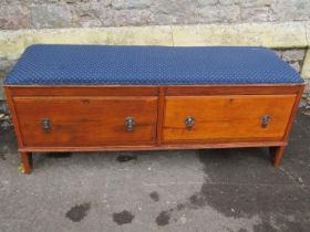 A large Low rectangular oak stool with upholstered seat over two drawers, 123cm long x 41cm wide x