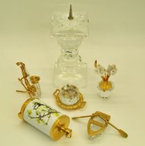 A group of Swarovski miniature pieces with gold gilt detail, including a cake, Saxophone ,a rowing