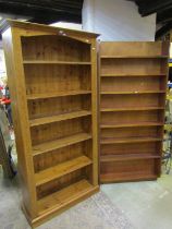 Two freestanding bookcases, a pine example with fluted sides, 200 cm high, 99 x 35 cm, together,