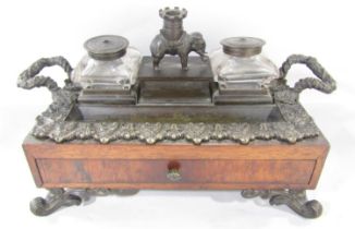 A Victorian rosewood ink stand the central section surmounted by an elephant with castellated houdah